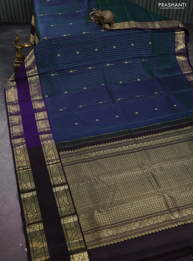 Pure kanchipuram silk saree dual shade of green and deep jamun with allover zari stripes pattern and zari woven border