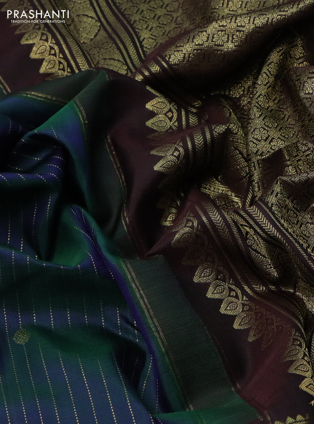 Pure kanchipuram silk saree dual shade of green and deep jamun with allover zari stripes pattern and zari woven border