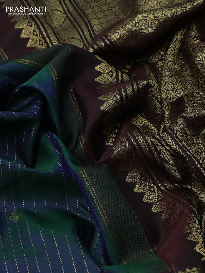 Pure kanchipuram silk saree dual shade of green and deep jamun with allover zari stripes pattern and zari woven border