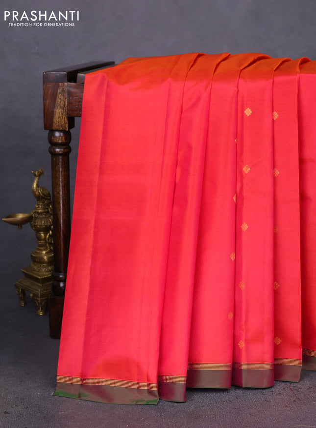 Pure kanchipuram silk saree dual shade of pinkish orange and dual shade of green with zari woven buttas and zari woven simple border
