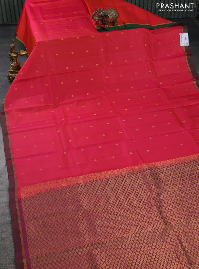 Pure kanchipuram silk saree dual shade of pinkish orange and dual shade of green with zari woven buttas and zari woven simple border