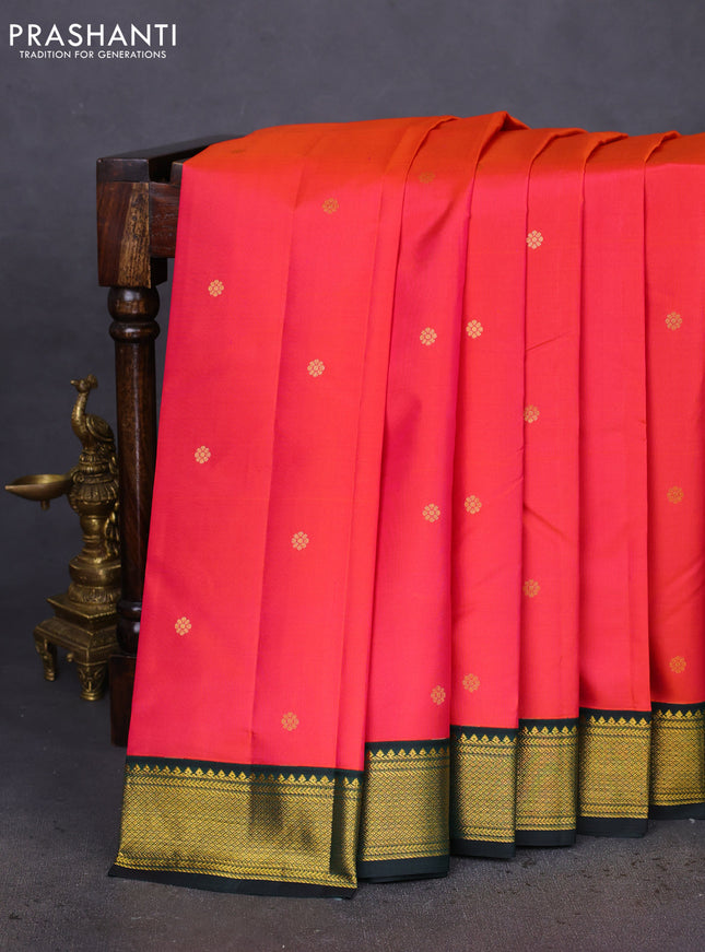 Pure kanchipuram silk saree dual shade of pinkish orange and bottle green with zari woven buttas and zari woven korvai border