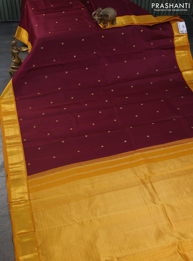 Pure kanchipuram silk saree deep maroon and yellow with zari woven buttas and zari woven korvai border