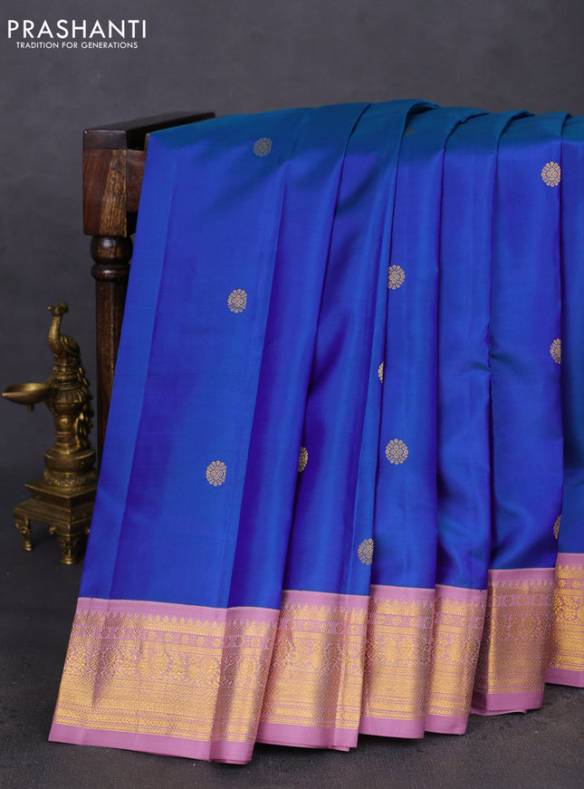 Pure kanchipuram silk saree dual shade of teal blue and mauve pink with zari woven buttas and zari woven korvai border