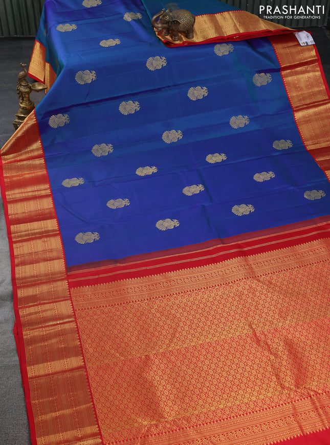 Pure kanchipuram silk saree dual shade of blue and red with peacock zari woven buttas and zari woven korvai border