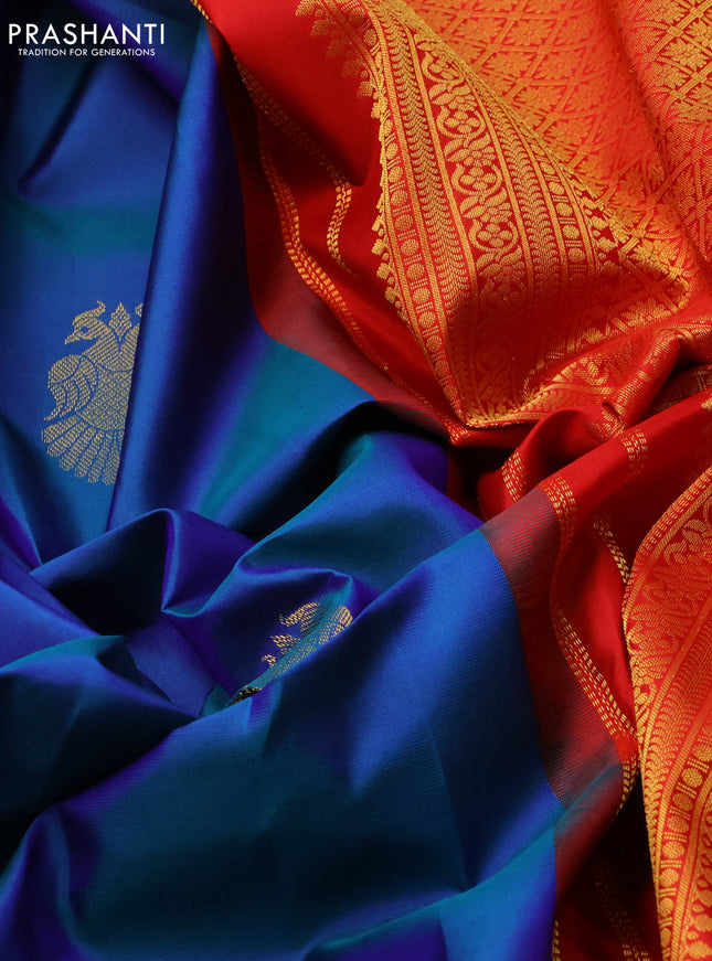 Pure kanchipuram silk saree dual shade of blue and red with peacock zari woven buttas and zari woven korvai border