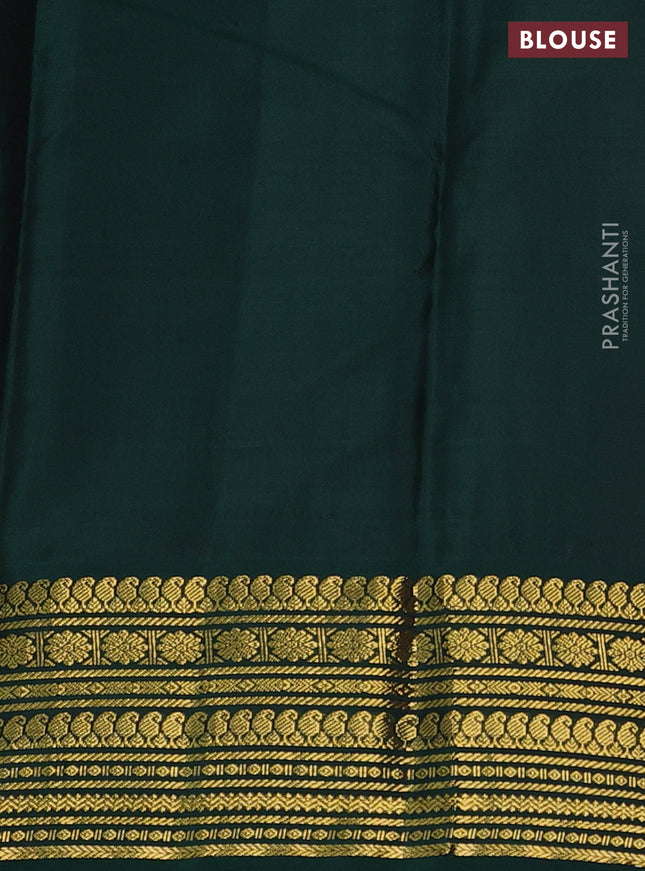 Pure kanchipuram silk saree dual shade of pinkish orange and green with zari woven buttas and zari woven korvai border