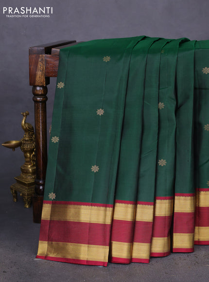 Pure kanchipuram silk saree dark green and dark magenta pink with zari woven floral buttas and zari woven border