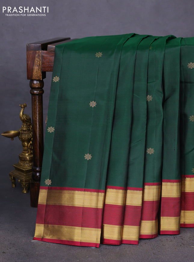 Pure kanchipuram silk saree dark green and dark magenta pink with zari woven floral buttas and zari woven border