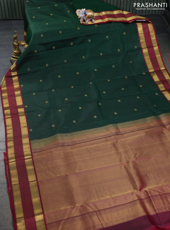 Pure kanchipuram silk saree dark green and dark magenta pink with zari woven floral buttas and zari woven border