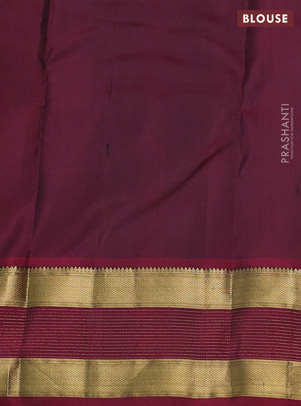 Pure kanchipuram silk saree dark green and dark magenta pink with zari woven floral buttas and zari woven border