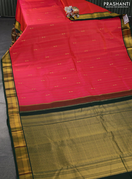 Pure kanchipuram silk saree dual shade of pinkish orange and green with allover zari stripes & zari buttas and zari woven korvai border