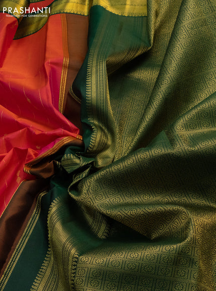 Pure kanchipuram silk saree dual shade of pinkish orange and green with allover zari stripes & zari buttas and zari woven korvai border