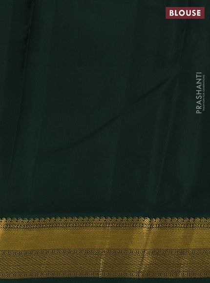 Pure kanchipuram silk saree dual shade of pinkish orange and green with allover zari stripes & zari buttas and zari woven korvai border