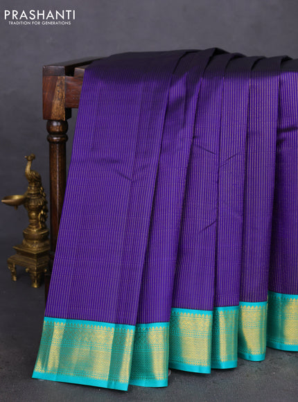 Pure kanchipuram silk saree blue and teal blue with allover zari stripes pattern and zari woven korvai border