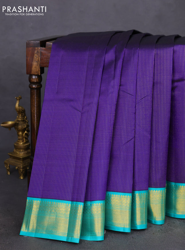 Pure kanchipuram silk saree blue and teal blue with allover zari stripes pattern and zari woven korvai border