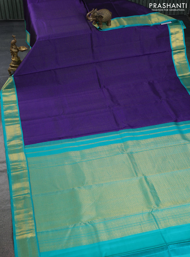 Pure kanchipuram silk saree blue and teal blue with allover zari stripes pattern and zari woven korvai border