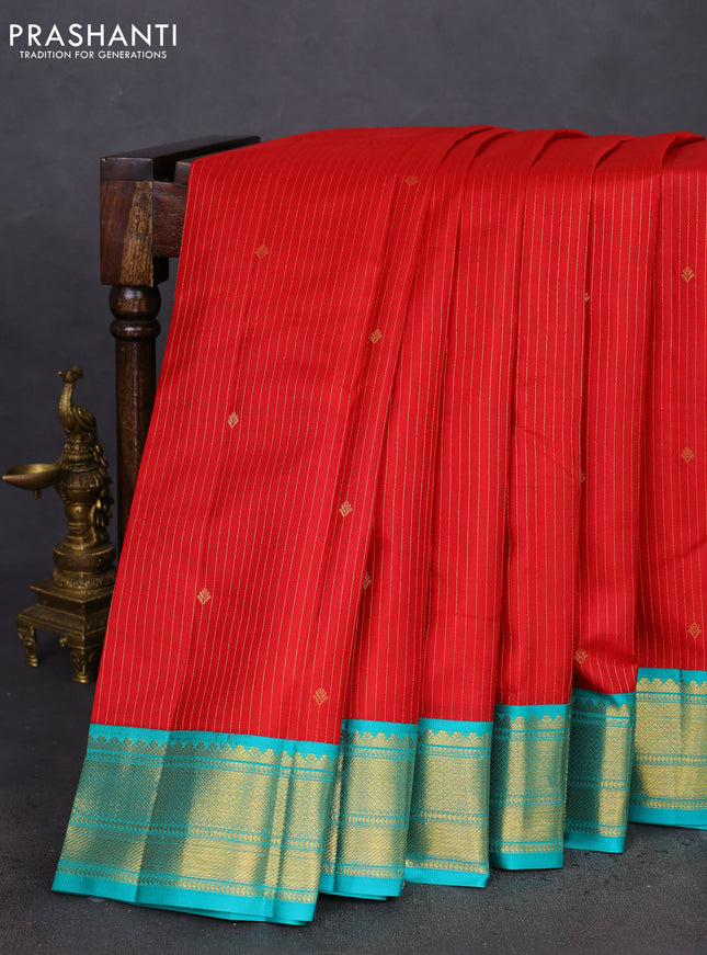 Pure kanchipuram silk saree red and teal blue with allover zari stripes & zari buttas and zari woven korvai border