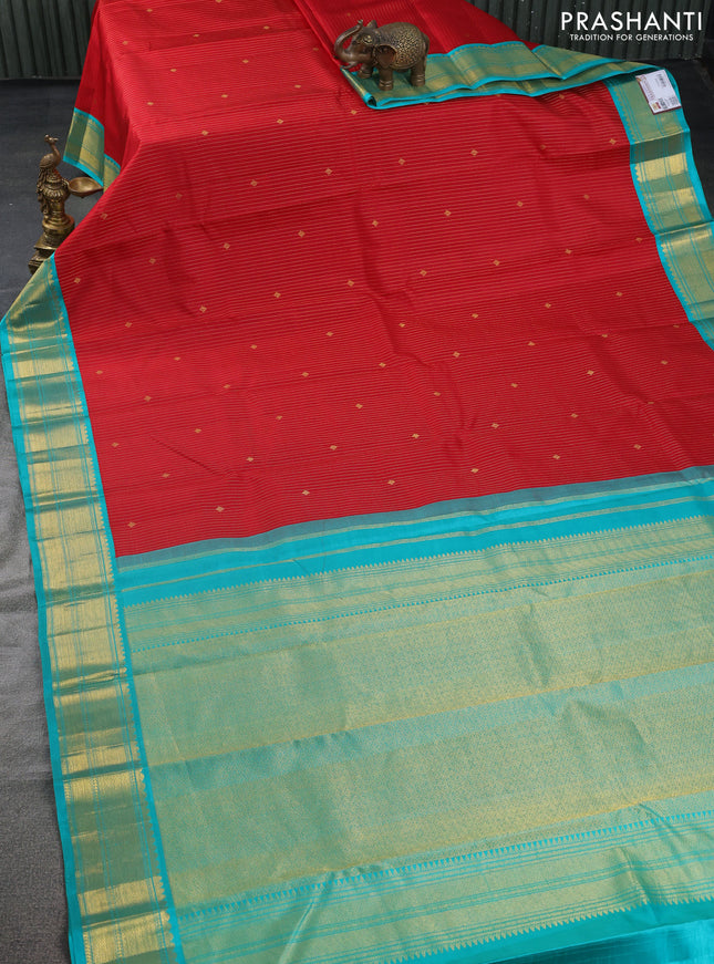 Pure kanchipuram silk saree red and teal blue with allover zari stripes & zari buttas and zari woven korvai border