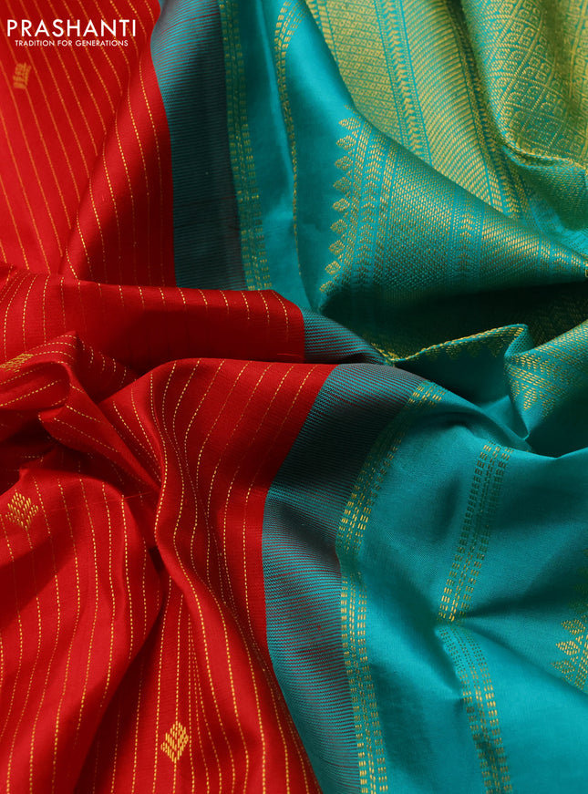 Pure kanchipuram silk saree red and teal blue with allover zari stripes & zari buttas and zari woven korvai border