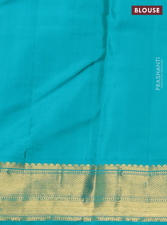 Pure kanchipuram silk saree red and teal blue with allover zari stripes & zari buttas and zari woven korvai border