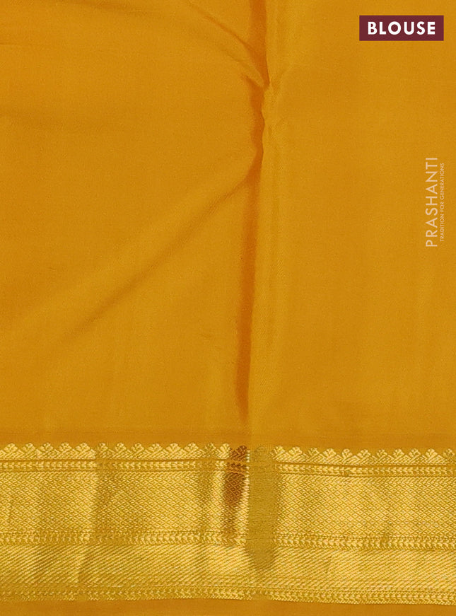 Pure kanchipuram silk saree dual shade of pinkish orange and yellow with allover zari stripes & zari buttas and zari woven korvai border
