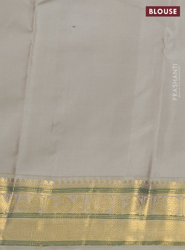 Pure kanchipuram silk saree green and beige with allover zari checks & buttas and annam zari woven korvai border
