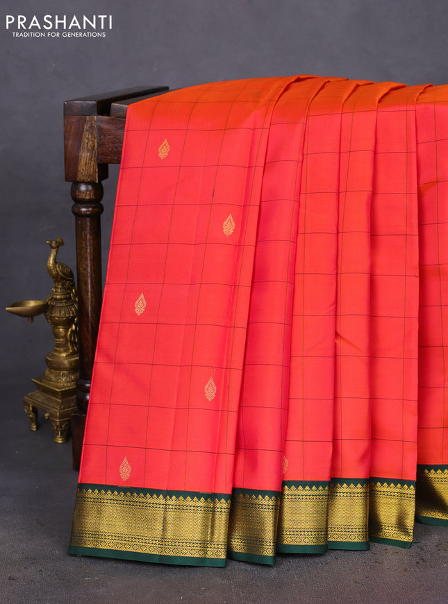 Pure kanchipuram silk saree dual shade of pinkish orange and green with allover checked pattern & zari buttas and zari woven korvai border