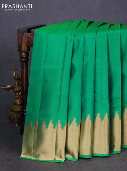 Pure kanchipuram silk saree cream with plain body and temple design zari woven border