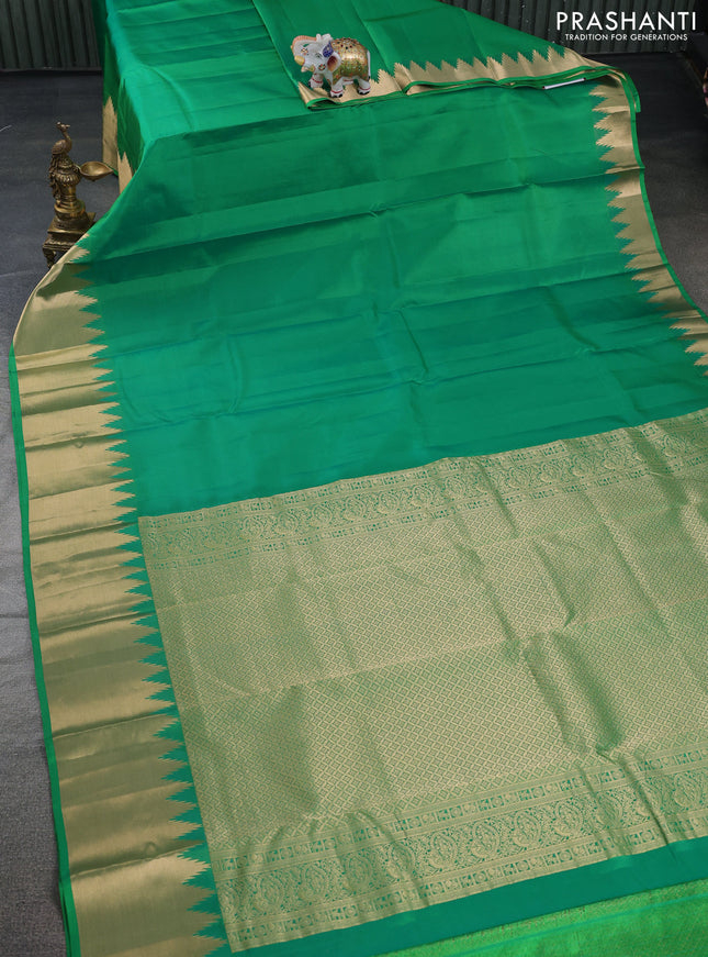 Pure kanchipuram silk saree cream with plain body and temple design zari woven border
