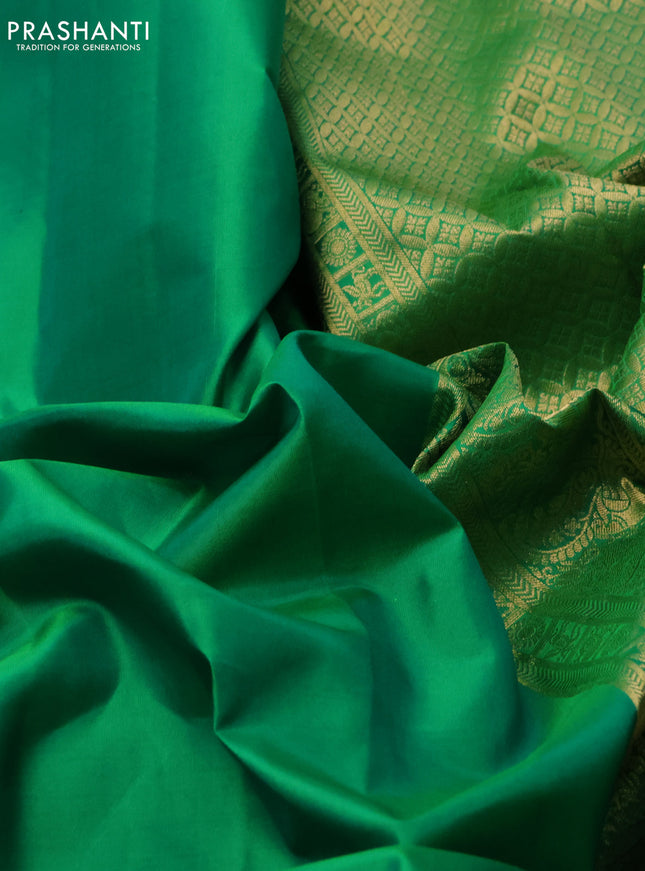 Pure kanchipuram silk saree cream with plain body and temple design zari woven border