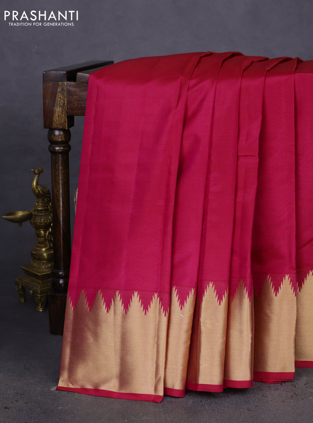 Pure kanchipuram silk saree dark pink with plain body and temple design zari woven border