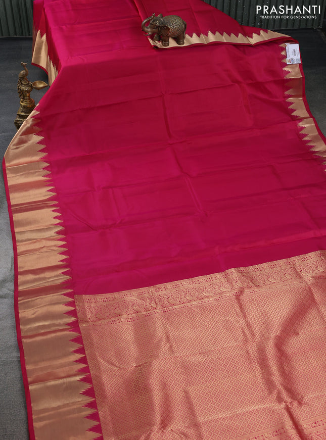 Pure kanchipuram silk saree dark pink with plain body and temple design zari woven border