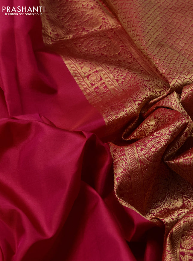 Pure kanchipuram silk saree dark pink with plain body and temple design zari woven border
