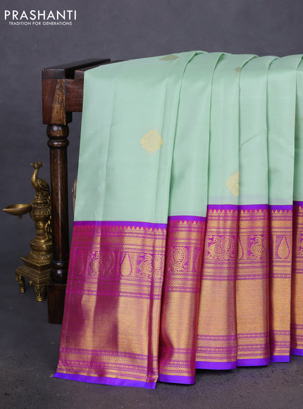 Pure kanchipuram silk saree pastel green and dual shade of purple with zari woven buttas and long zari woven korvai border