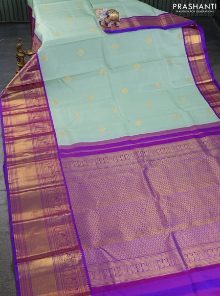 Pure kanchipuram silk saree pastel green and dual shade of purple with zari woven buttas and long zari woven korvai border