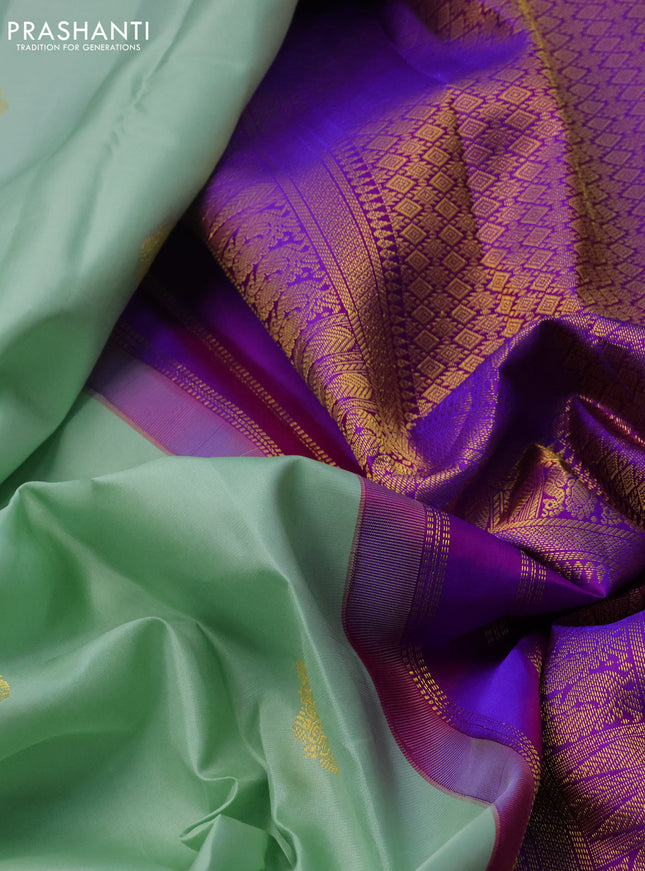 Pure kanchipuram silk saree pastel green and dual shade of purple with zari woven buttas and long zari woven korvai border
