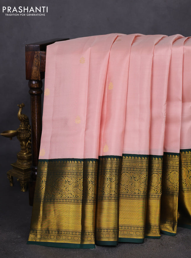 Pure kanchipuram silk saree pastel peach and dark green with zari woven buttas and long zari woven korvai border