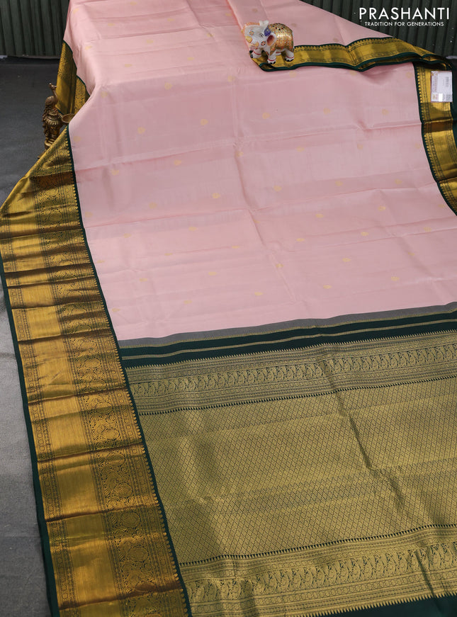 Pure kanchipuram silk saree pastel peach and dark green with zari woven buttas and long zari woven korvai border