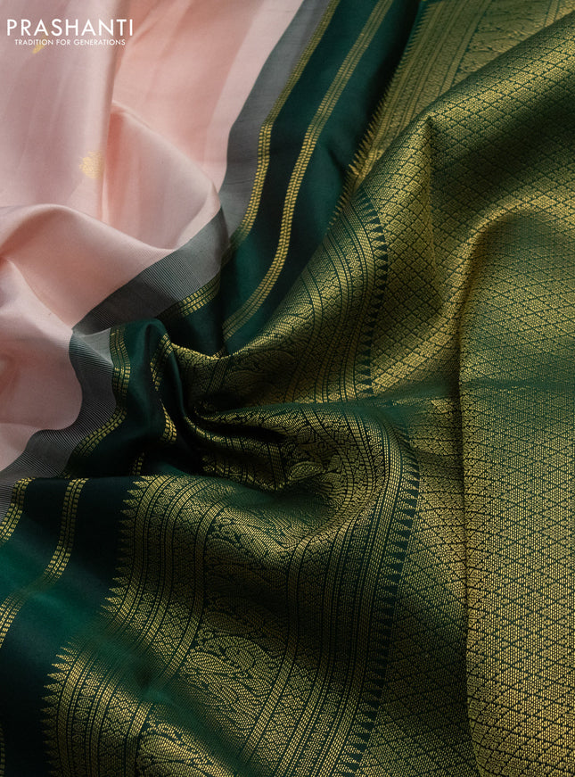 Pure kanchipuram silk saree pastel peach and dark green with zari woven buttas and long zari woven korvai border