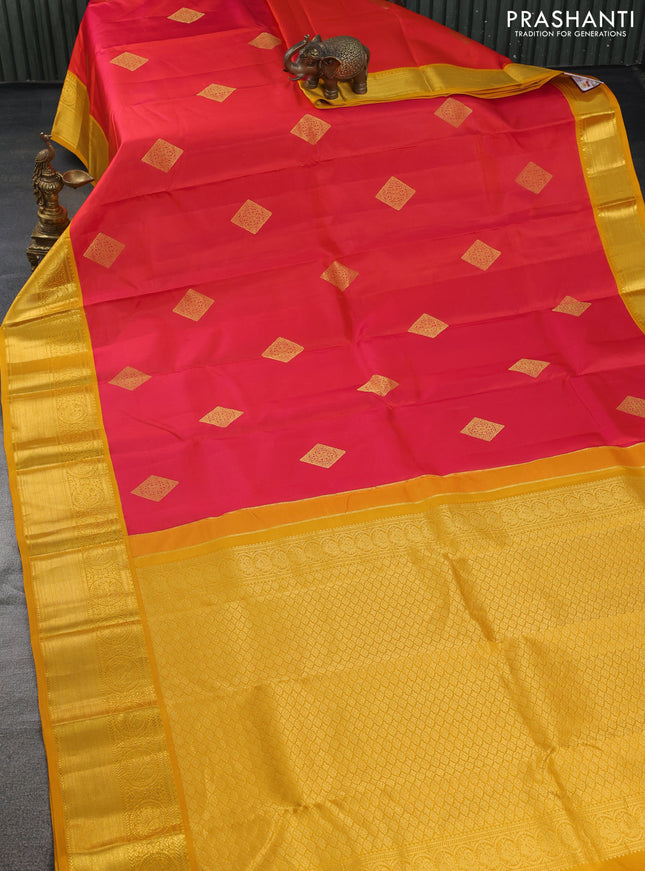 Pure kanchipuram silk saree dual shade of pinkish orange and mustard yellow with zari woven buttas and zari woven korvai border