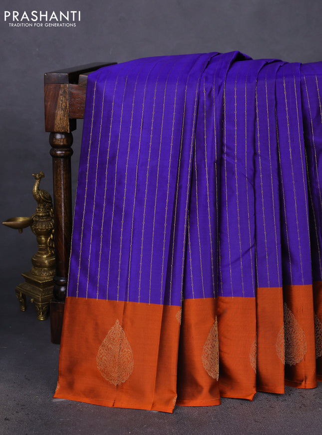 Pure kanchipuram silk saree blue and orange with allover stripes pattern and zari woven butta border