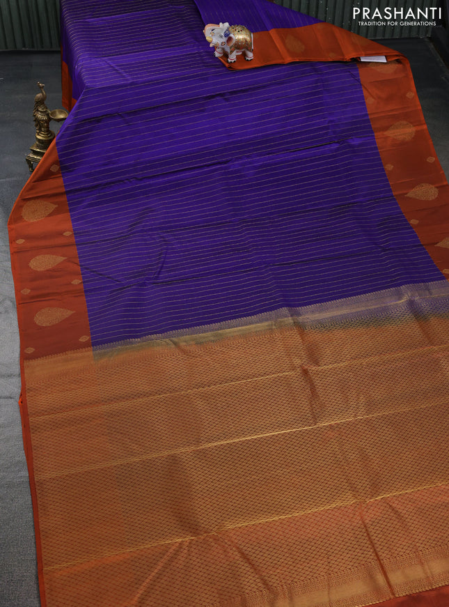 Pure kanchipuram silk saree blue and orange with allover stripes pattern and zari woven butta border