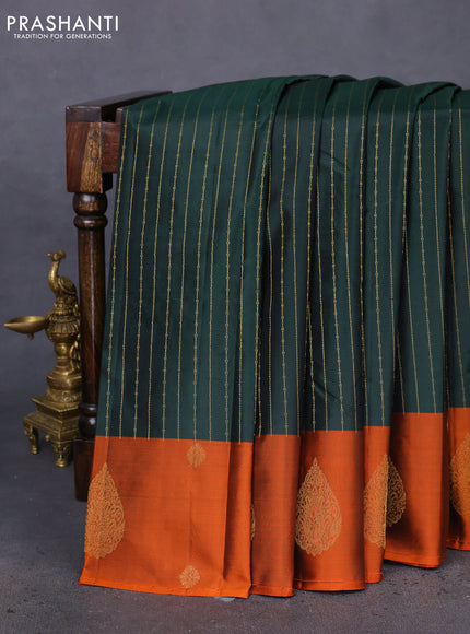 Pure kanchipuram silk saree bottle green and orange with allover stripes pattern and zari woven butta border