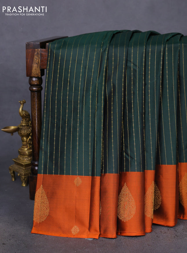 Pure kanchipuram silk saree bottle green and orange with allover stripes pattern and zari woven butta border