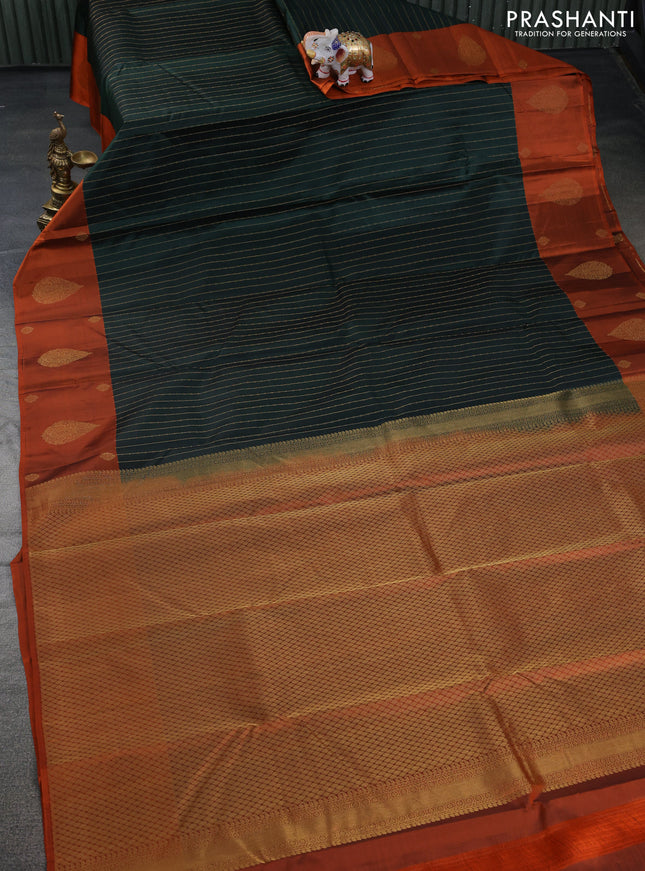 Pure kanchipuram silk saree bottle green and orange with allover stripes pattern and zari woven butta border