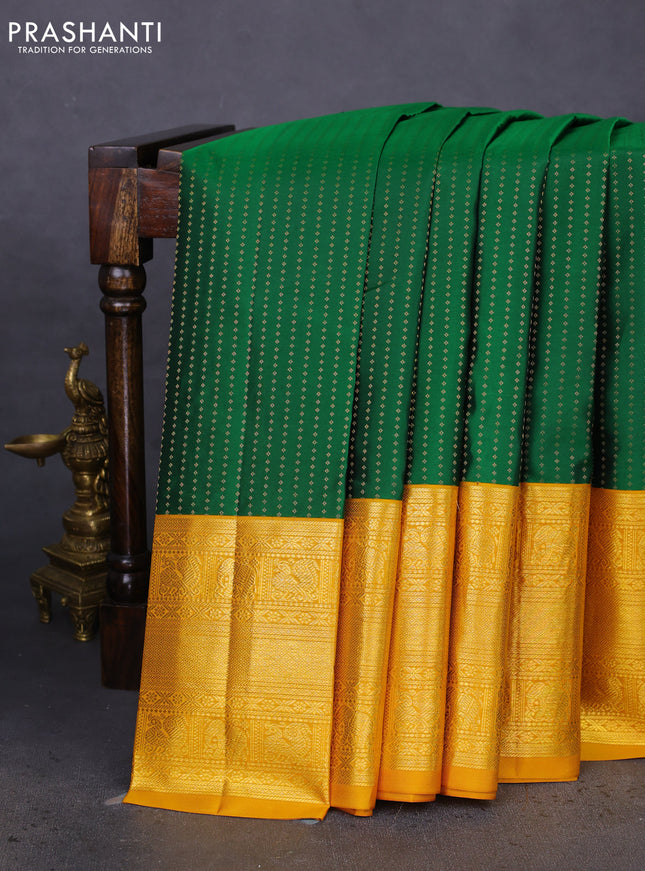 Pure kanchipuram silk saree green and mustard yellow with allover zari woven butta weaves and long zari woven korvai border