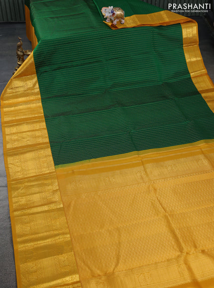 Pure kanchipuram silk saree green and mustard yellow with allover zari woven butta weaves and long zari woven korvai border
