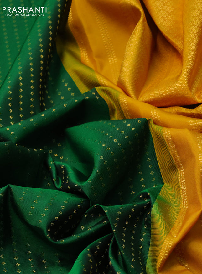 Pure kanchipuram silk saree green and mustard yellow with allover zari woven butta weaves and long zari woven korvai border