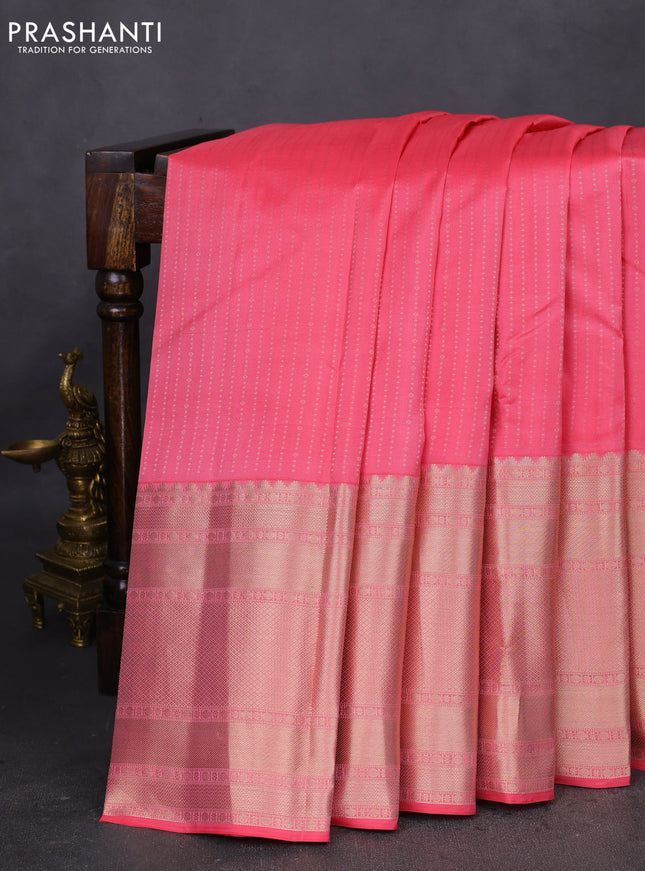 Pure kanchipuram silk saree peach pink with allover zari woven butta weaves and long zari woven korvai border